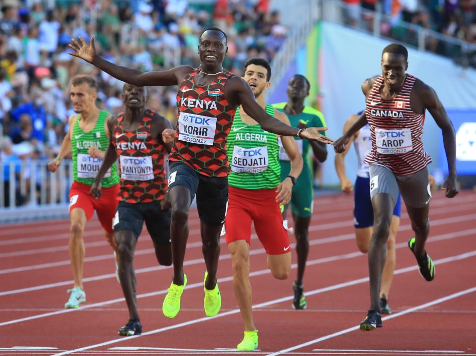 Kenya's Emmanuel Kipkurui Korir, center, celebrates his victory in the men's 800 meters on day nine of the World Athletics Championships at Hayward Field in Eugene, Oregon Saturday, July 23, 2022.