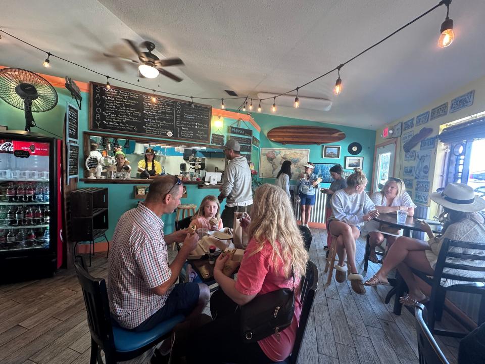 Dining area of Gypsea crepes filled with people 