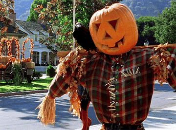 Lorelai and Rory Gilmore walking through the town of Stars Hallow during Halloween