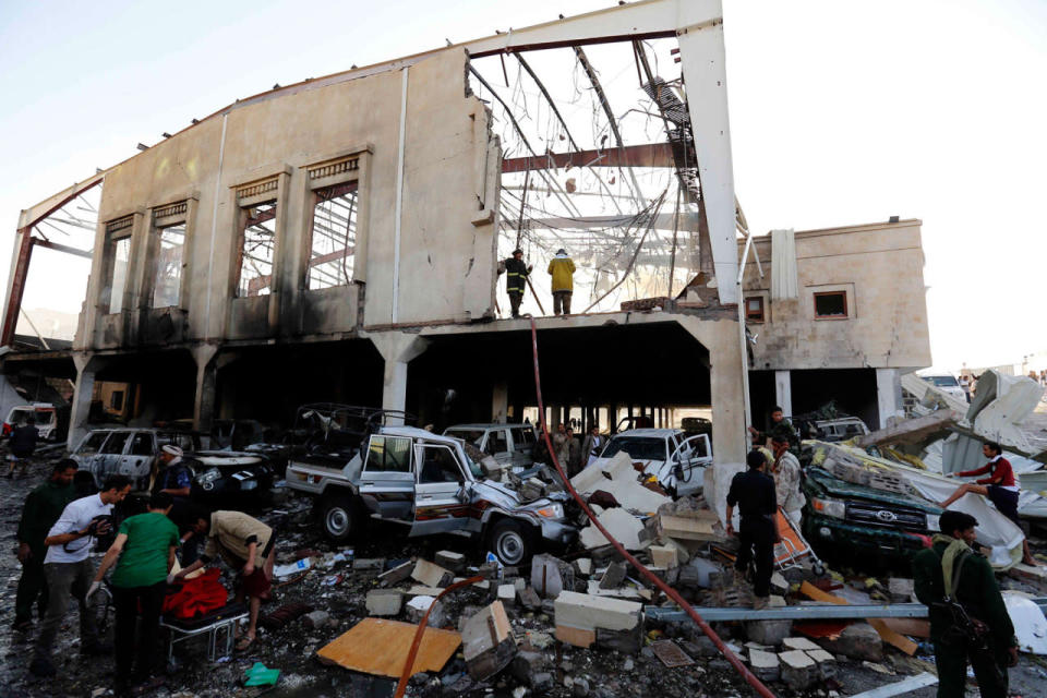 <p>People inspect the aftermath of a Saudi-led coalition airstrike in Sanaa, Yemen, Saturday, Oct. 8, 2016. (AP Photo/Osamah Abdulrhman)</p>