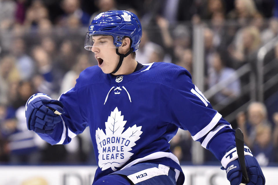 FILE - In this Jan. 31, 2018, file photo, Toronto Maple Leafs center Mitch Marner (16) celebrates his goal against the New York Islanders during the second period of an NHL hockey game in Toronto. With NHL training camps set to open this week, roughly a dozen prominent restricted free agents still don’t have contracts, including Tampa Bay’s Brayden Point, Toronto’s Mitch Marner, Boston’s Charlie McAvoy and Brandon Carlo and Colorado’s Mikko Rantanen. Those absences could hang over their teams for days, weeks or even months and have raised questions about why it’s taken so long to get them signed. (Frank Gunn/The Canadian Press via AP, File)