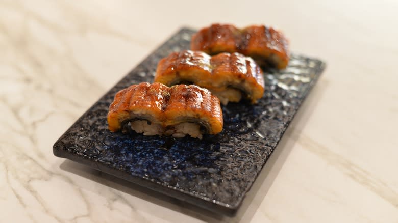 Grilled eel sushi on plate
