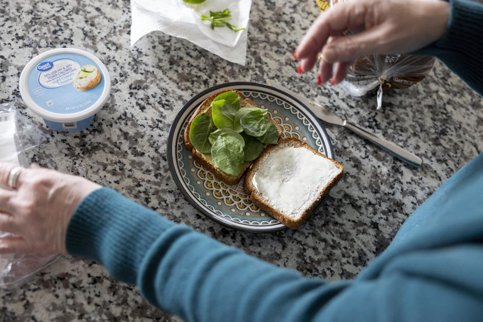 Donna Cooper prepares a roast beef sandwich with a recipe from the Mayo Clinic at her home in Front Royal, Va., on Friday, March 1, 2024. (AP Photo/Amanda Andrade-Rhoades)