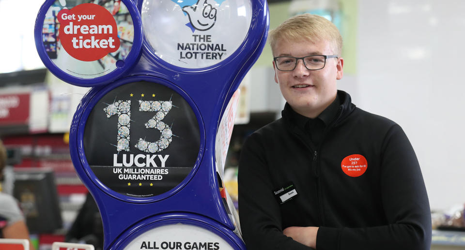 Shop assistant Sean Grant in the Scotmid Co-Operative store in Laurencekirk, Aberdeenshire, where he ripped up the winning lottery ticket belonging to Fred and Lesley Higgins. Source: PA Wire via AAP