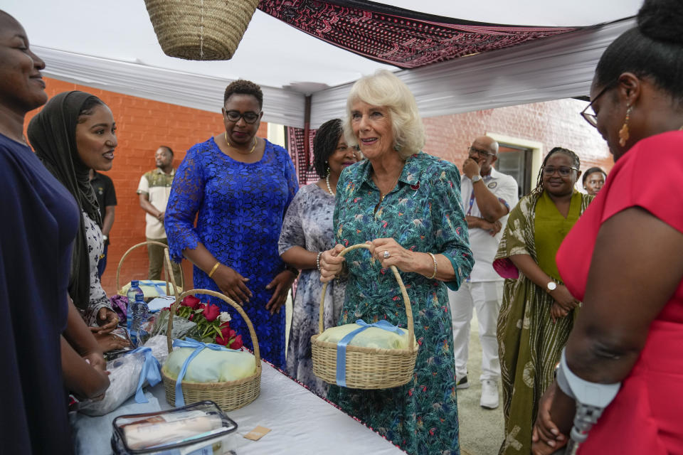 Britain's Queen Camilla, center right, holds a meeting with staff, volunteers and survivors of sexual and gender-based violence at the offices of an organization called Sauti ya Wanawake, Swahili for the Voice of Women, in Tononoka area of Mombasa, Kenya, Thursday, Nov. 3, 2023. (AP Photo/Brian Inganga, Pool)
