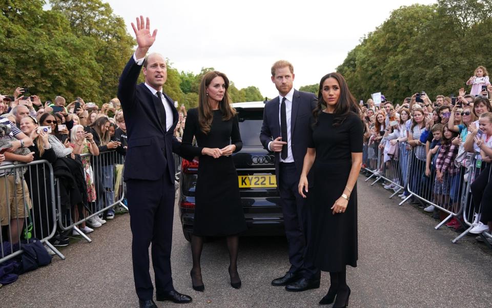 Catherine, Princess of Wales, Prince William, Prince of Wales, Prince Harry, Duke of Sussex, and Meghan, Duchess of Sussex meet members of the public on the long Walk at Windsor Castle - Kirsty O'Connor/Getty Images