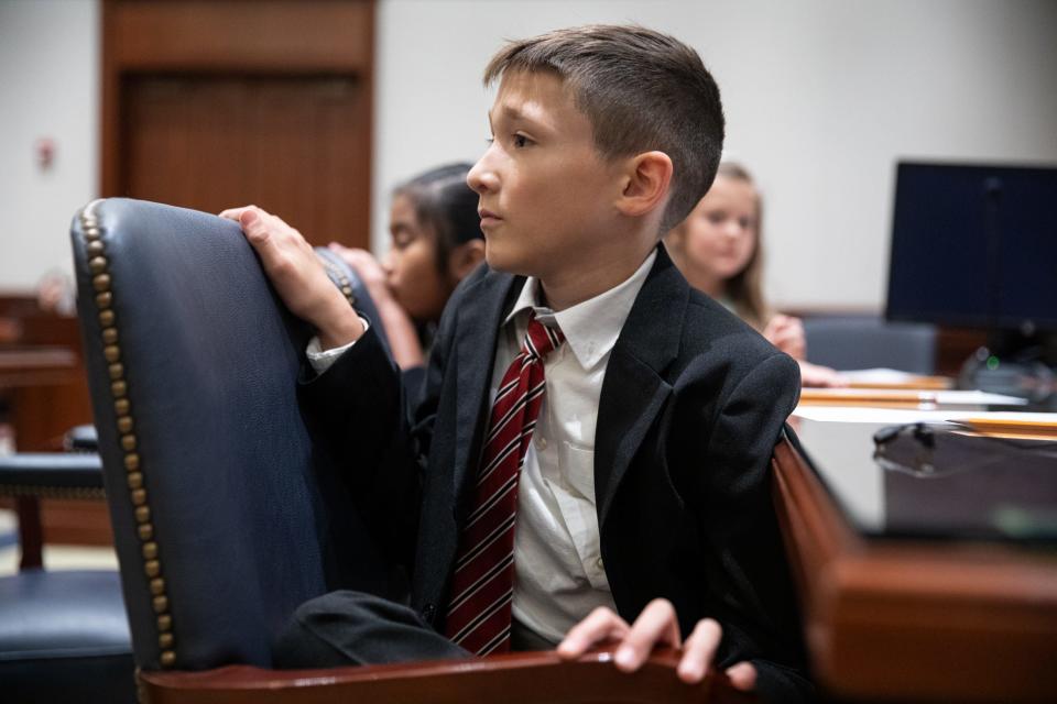 Flour Bluff student Kyle Ostrander, portraying a courtroom sketch artist, listens to opening arguments during a mock trial at the Federal Courthouse on Thursday, Nov. 16, 2023, in Corpus Christi, Texas.