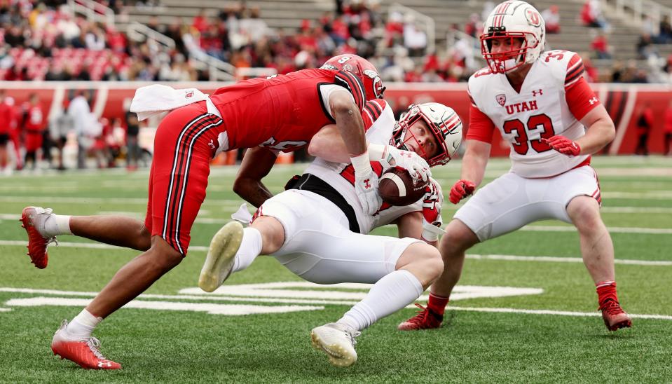 Red’s Elijah Davis, puts White’s Jett Meine, down on the last play of the game as The University of Utah football team plays in the 22 Forever Game at Rice Eccles Stadium in Salt Lake City on Saturday, April 22, 2023. the white team won 38-28 over red. | Scott G Winterton, Deseret News