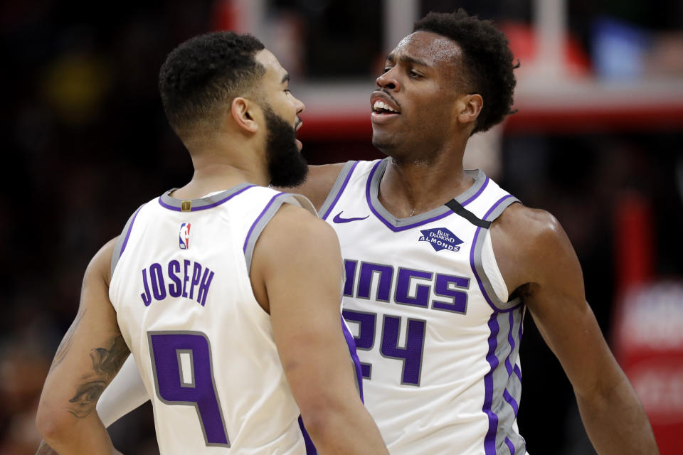 Sacramento Kings guard Cory Joseph, left, celebrates with guard Buddy Hield after scoring basket during the second half of an NBA basketball game against the Chicago Bulls in Chicago, Friday, Jan. 24, 2020. The Kings won 98-81.(AP Photo/Nam Y. Huh)