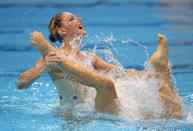 Eloise Amberger and Sarah Bombell of Australia compete during the women's duet synchronized swimming technical routine at the Aquatics Centre in the Olympic Park during the 2012 Summer Olympics in London, Sunday, Aug. 5, 2012. (AP Photo/Mark J. Terrill)