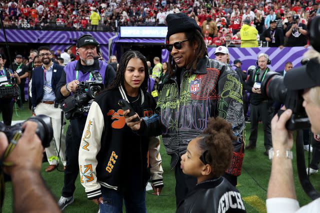 <p>Ezra Shaw/Getty</p> Jay-Z, Blue Ivy Carter and Rumi Carter at Allegiant Stadium on February 11, 2024 in Las Vegas, Nevada.