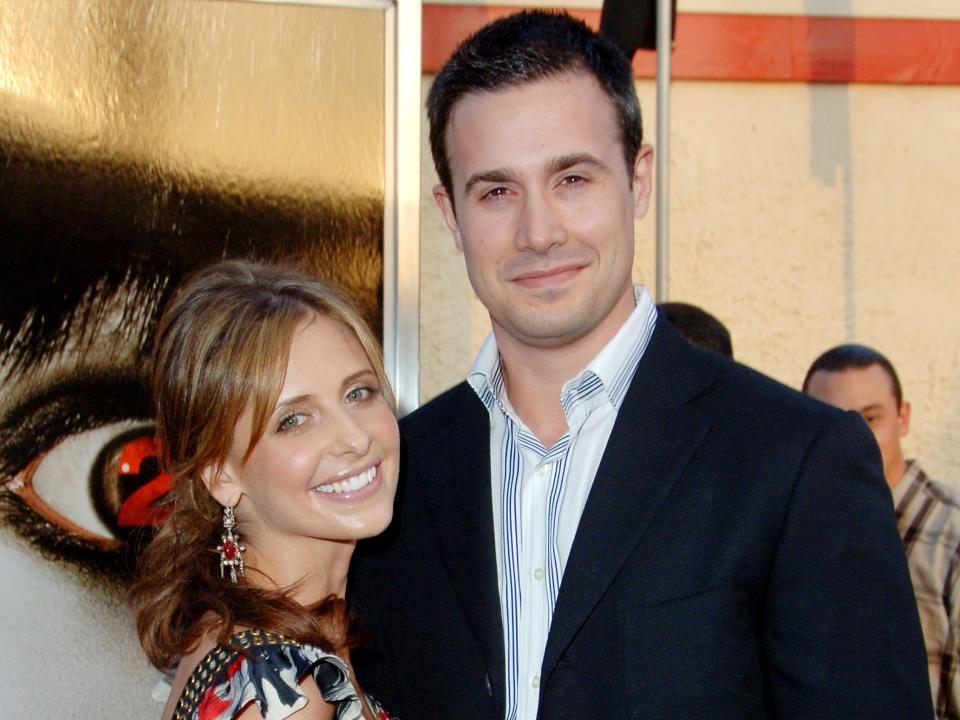 Sarah Michelle Gellar and Freddie Prinze Jr. pose on the red carpet during a 2006 film premiere.