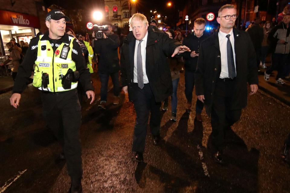 Boris Johnson visits the flood-hit town of Matlock, Derbyshire (REUTERS)