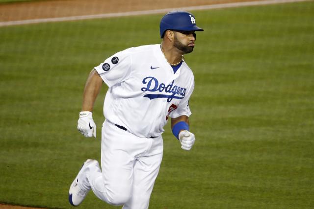 Los Angeles Dodgers first baseman Yoshi Tsutsugo (28) singles and