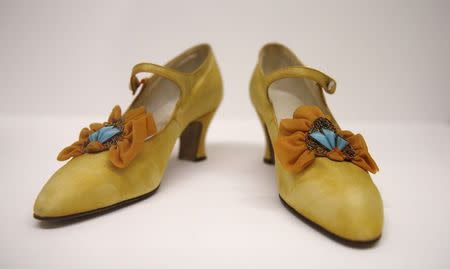 Women's shoes from the 1920's are displayed in the "Women Fashion Power exhibition at the Design Museum in London November 4, 2014. REUTERS/Suzanne Plunkett