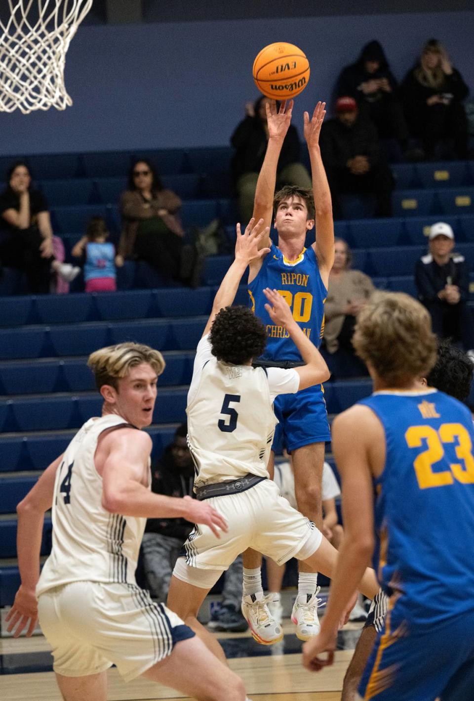 Ripon Christian’s Mason Tameling attempts a shot over Central Catholic’s James Mcgee during the Mark Gallo Invitational Basketball Tournament at Central Catholic High School in Modesto, Calif., Saturday, Dec. 9, 2023.