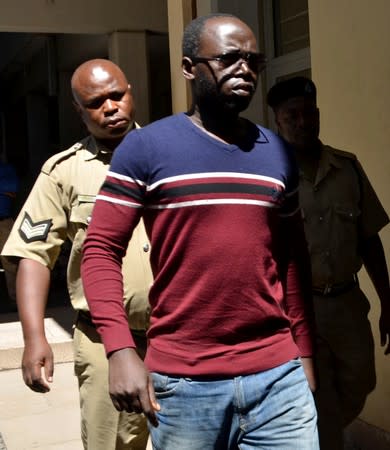 Tanzanian investigative journalist Erick Kabendera arrives at the Kisutu Residents Magistrate Court in Dar es Salaam