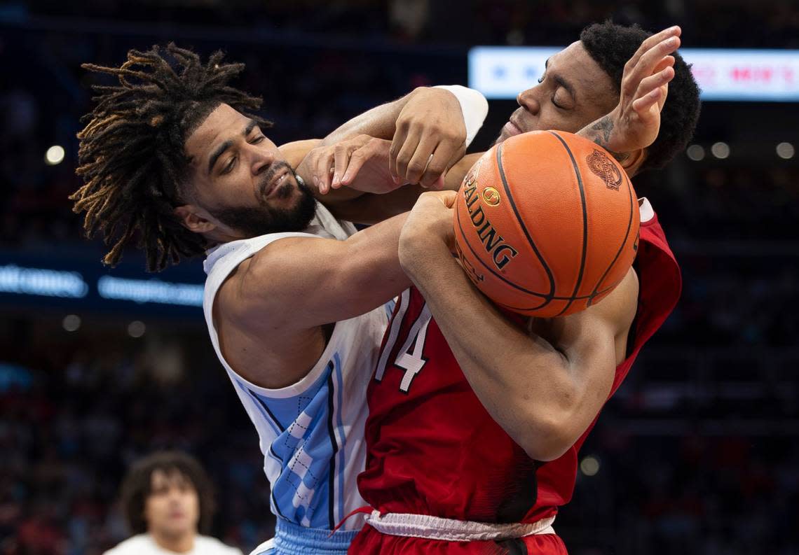North Carolina’s R.J. Davis (4) tangles with Casey Morsell (14) for control of the ball in the second half during the ACC Men’s Basketball Tournament Championship at Capitol One Arena on Saturday, March 16, 2024 in Washington, D.C.