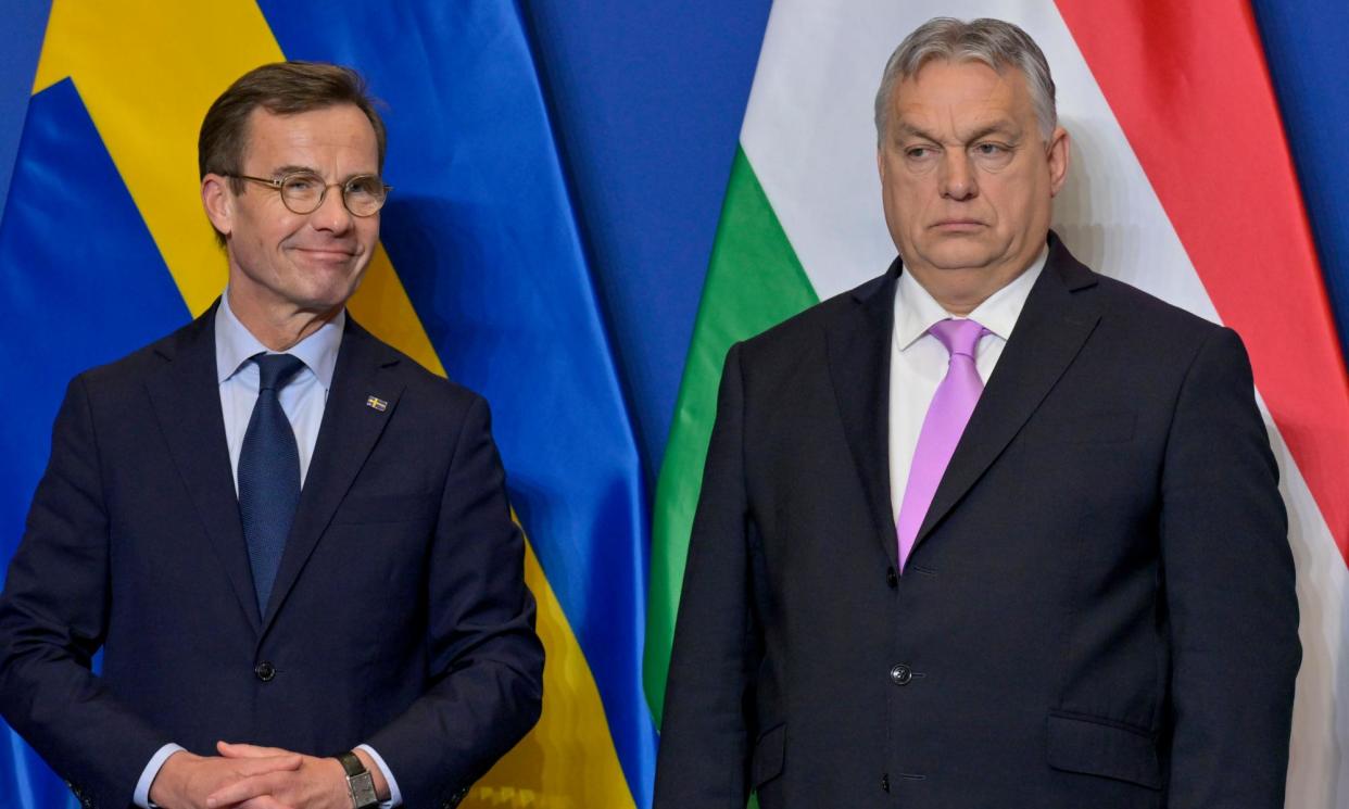 <span>Ulf Kristersson (left) and Viktor Orban in Budapest on Friday. The Hungarian PM said: ‘Being members of Nato means that we are prepared to die for each other.’</span><span>Photograph: Dénes Erdős/AP</span>