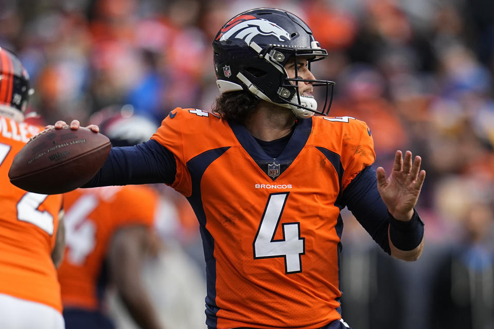 Denver Broncos quarterback Jarrett Stidham (4) works in the pocket against the Los Angeles Chargers during the first half of an NFL football game, Sunday, Dec. 31, 2023, in Denver. (AP Photo/Jack Dempsey)