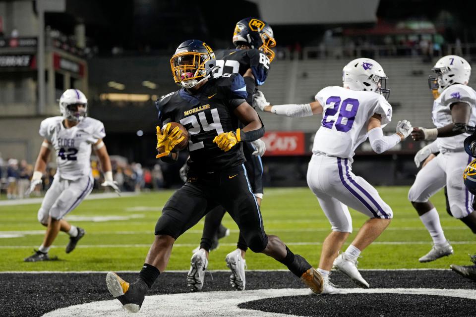 Moeller running back Jordan Marshall (24) runs in for a touchdown in the second quarter of the game between the Elder High School Panthers and the Moeller High School Crusaders at Nippert Stadium in Cincinnati on Friday, Sept. 30. Marshall was named GCL-South Player of the Year Thursday, Oct. 27.