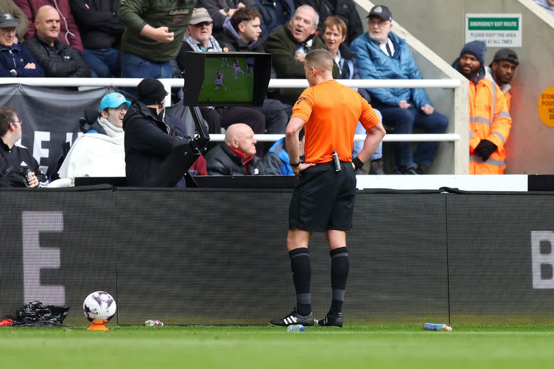 Rob Jones checks the Video Assistant Referee screen