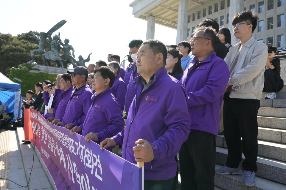 Bereaved family members of the victims of the Halloween crush in 2022 and opposition lawmakers hold a press conference at the National Assembly in Seoul, South Korea, Thursday, May 2, 2024. South Korea's parliament on Thursday approved legislation mandating a new, independent investigation into the 2022 Halloween crush in Seoul that killed 159 people. (AP Photo/Ahn Young-joon)