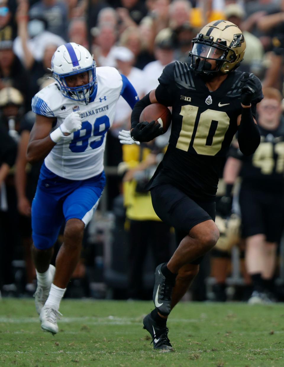 Purdue Boilermakers safety Cam Allen (10) returns an interception for a touchdown during the NCAA football game against the Indiana State Sycamores, Saturday, Sept. 10, 2022, at Ross-Ade Stadium in West Lafayette, Ind. Purdue won 56-0.