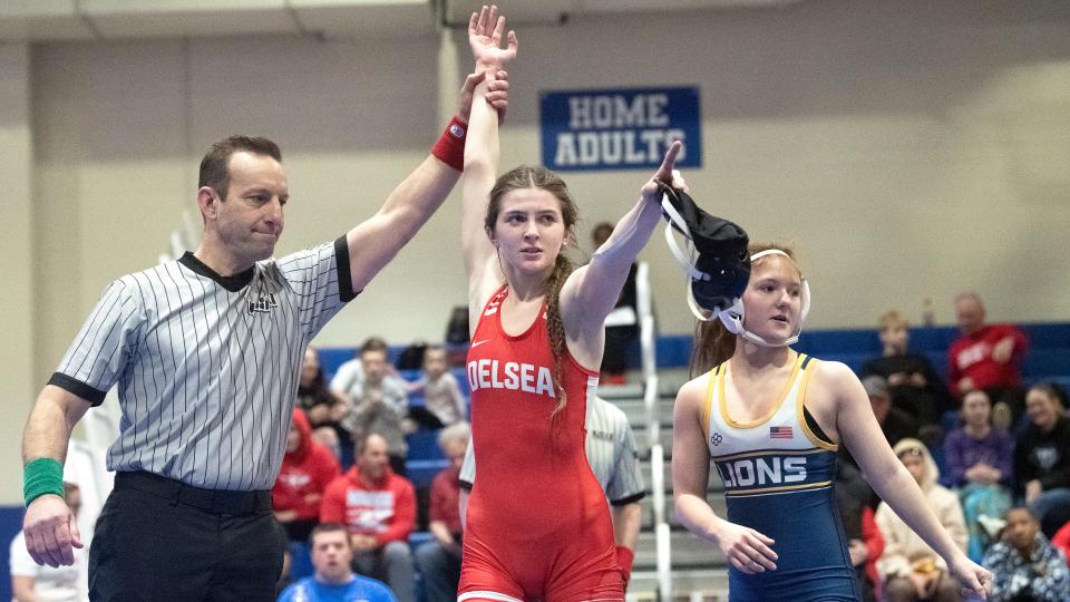 Delsea's Emma Coesfeld celebrates after pinning Gloucester's  Jacklyn McDowell to win the 107 lb. final bout of the South Region girls wrestling tournament held at Williamstown High School on Sunday, February 19, 2023.