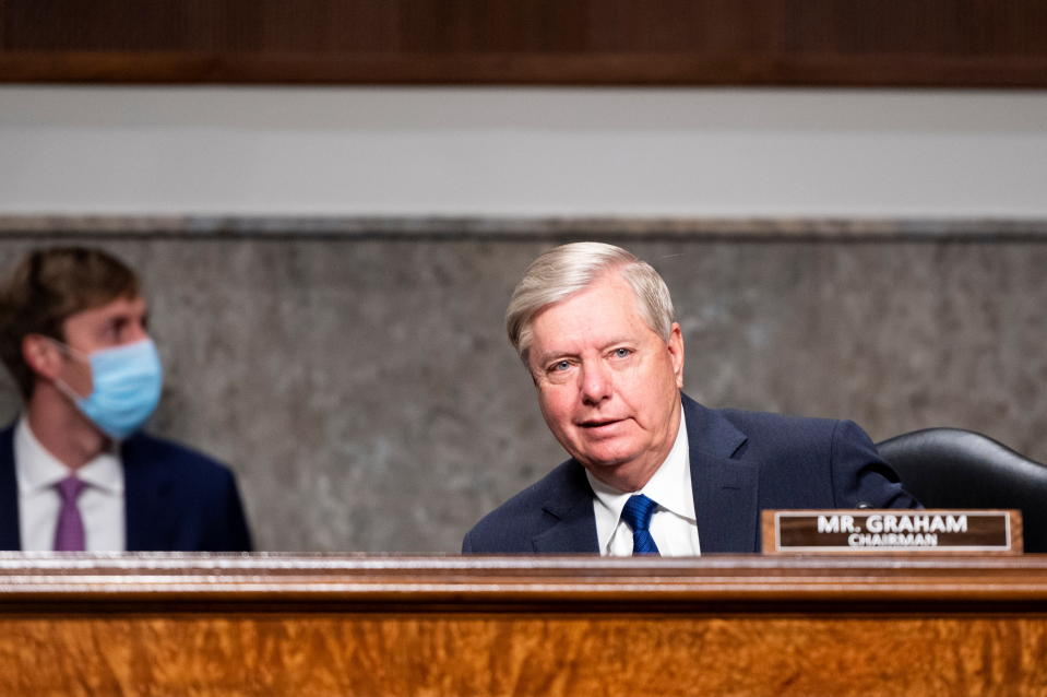 Chairman Senator Lindsey Graham, R-S.C., takes his seat during the Senate Judiciary Committee hearing on "Breaking the News: Censorship, Suppression, and the 2020 Election", in Washington, U.S., November 17, 2020. Bill Clark/Pool via REUTERS