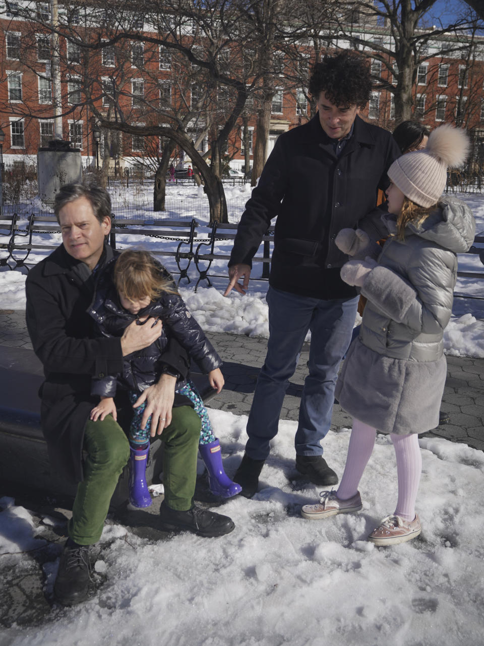 New York State Senator Brad Hoylman, left, with his husband David Sigal, right, with their daughters Lucy Hoylman-Sigal, 3, left, and Silvia Hoylman-Sigal, 10, both born through surrogacy, Saturday Feb. 6, 2021, in New York. Sen. Hoylman is the lead sponsor of a New York State law taking effect on Feb. 15 that legalizes commercial surrogacy. (AP Photo/Bebeto Matthews)