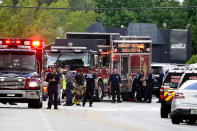 Fire and rescue personnel work in the area where a medical rescue helicopter crashed, Monday, Aug. 28, 2023, in Pompano Beach, Fla. (AP Photo/Marta Lavandier)