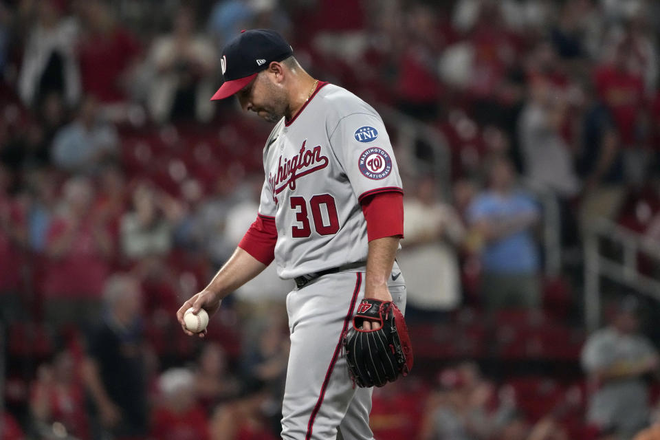 Washington Nationals relief pitcher Paolo Espino pauses on the mound after giving up a solo home run to St. Louis Cardinals' Nolan Arenado during the eighth inning in the second game of a baseball doubleheader Saturday, July 15, 2023, in St. Louis. (AP Photo/Jeff Roberson)