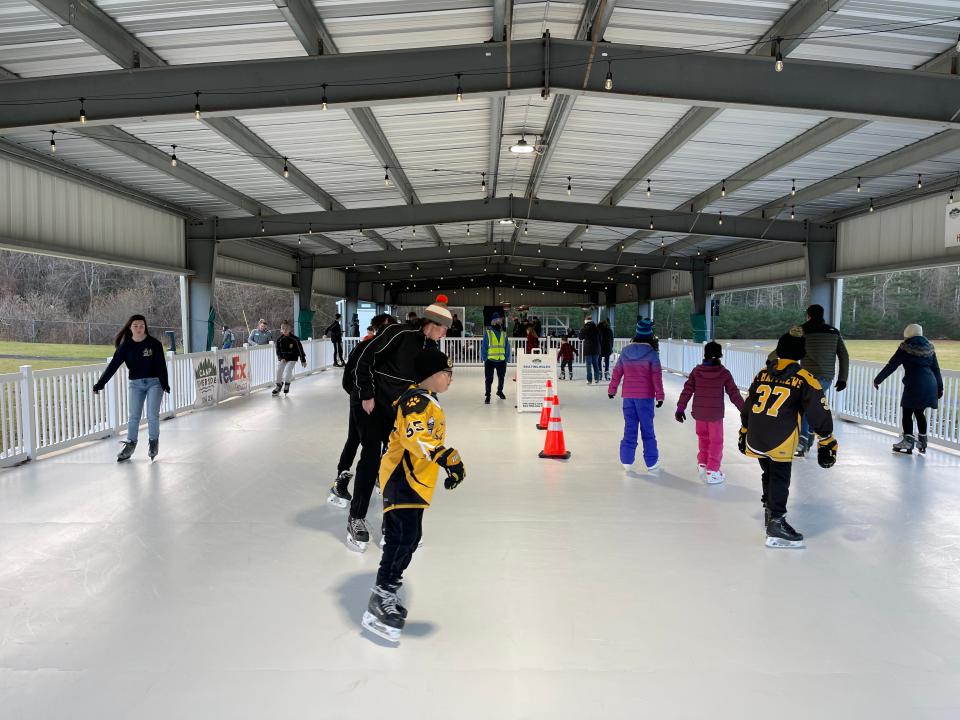 Members of the community skate on the synthetic rink at the Boys & Girls Clubs of Metro South's Camp Riverside in Taunton.