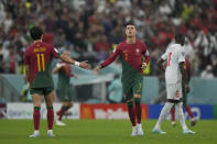 Portugal's Cristiano Ronaldo, right, runs during the World Cup round of 16 soccer match between Portugal and Switzerland, at the Lusail Stadium in Lusail, Qatar, Tuesday, Dec. 6, 2022. (AP Photo/Alessandra Tarantino)