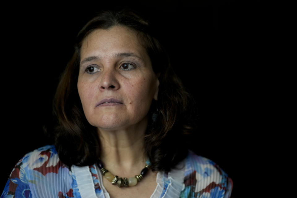 Lucia Gimenez, who worked for Opus Dei for 18 years as a numerary assistant, poses for a photo in Buenos Aires, Argentina, Thursday, Oct. 21, 2021. Giménez, now 56, says she joined the conservative Catholic group in her native Paraguay at the age of 14 with the promise that she would receive a higher education. But instead of math or history, she was trained in cooking, cleaning and other household chores to serve in Opus Dei centers, residences and retirement homes. (AP Photo/Natacha Pisarenko)