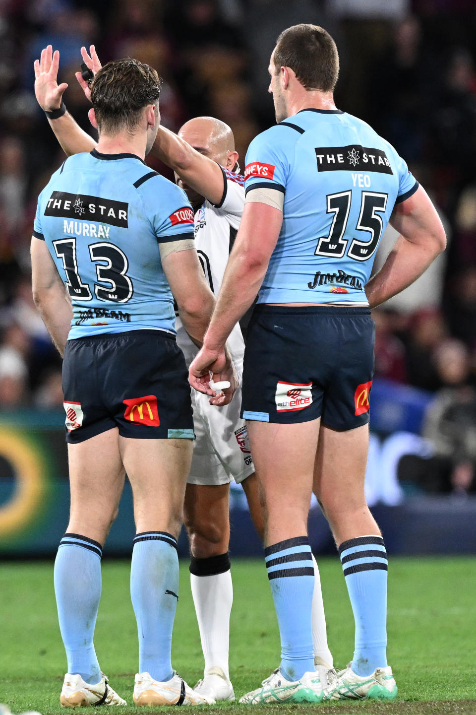 BRISBANE, AUSTRALIA - JULY 17: Cameron Murray of the Blues is sent to the sin bin by referee Ashley Klein during game three of the 2024 Men's State of Origin series between Queensland Maroons and New South Wales Blues at Suncorp Stadium on July 17, 2024 in Brisbane, Australia. (Photo by Bradley Kanaris/Getty Images)