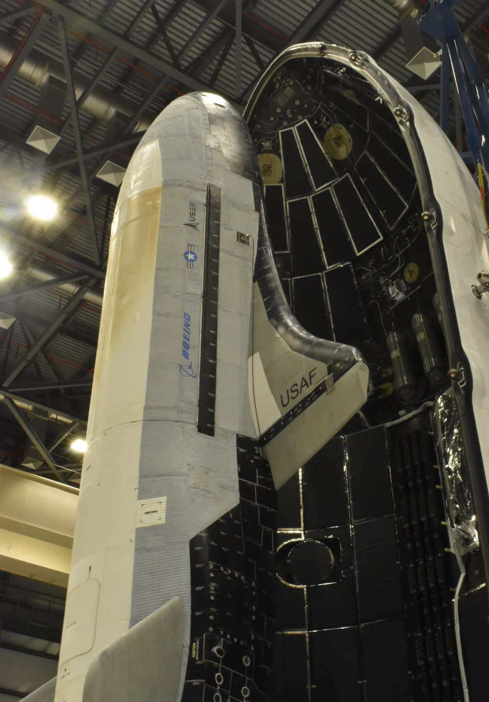 A picture shows the US Space Force X37B being loaded into its cargo hold.