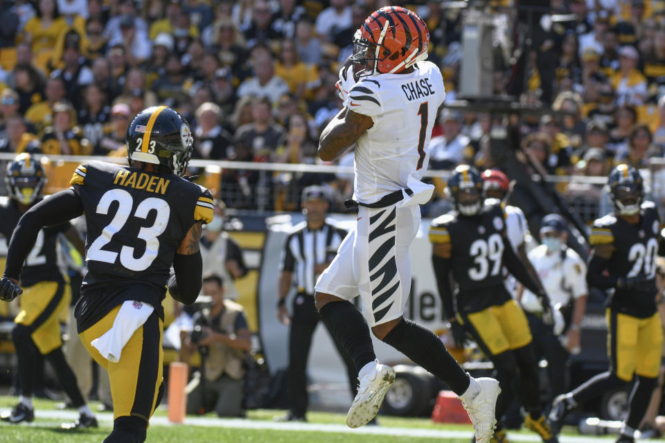 Cincinnati Bengals wide receiver Ja'Marr Chase (1) makes a touchdown catch in front of Pittsburgh Steelers cornerback Joe Haden (23) during the second half an NFL football game, Sunday, Sept. 26, 2021, in Pittsburgh. (AP Photo/Don Wright)