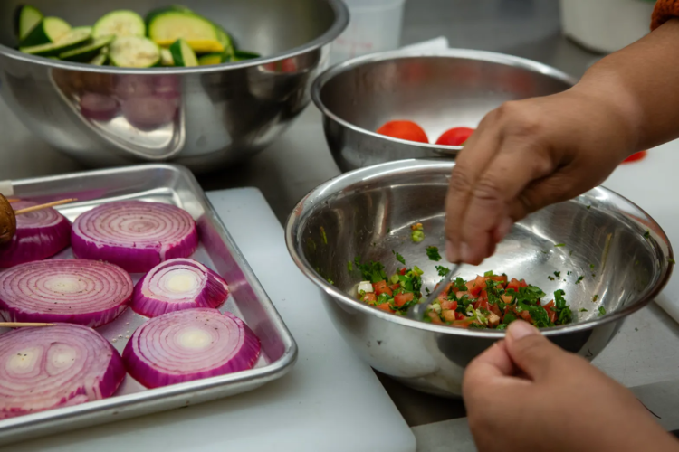 School food service workers train at the Culinary Institute of America as part of Farm to School, an initiative to provide healthier lunches in California schools, in Napa on Aug. 3, 2023. (Semantha Norris/CalMatters)