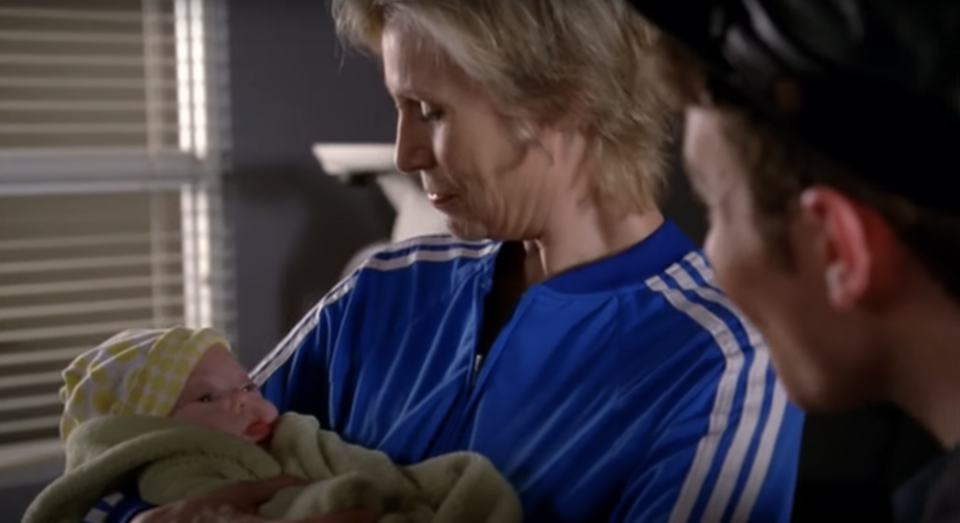 Sue holding her baby 