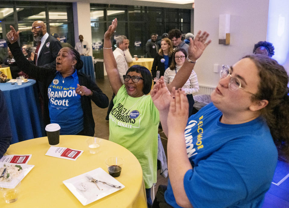 Diana Turner, Rita Crews and Rebecca Mark celebrate as election results roll in during the watch party for Baltimore Mayor Brandon Scott, in Baltimore, Tuesday, May 14, 2024. Scott is facing off against former mayor Sheila Dixon. (Jessica Gallagher/The Baltimore Banner via AP)
