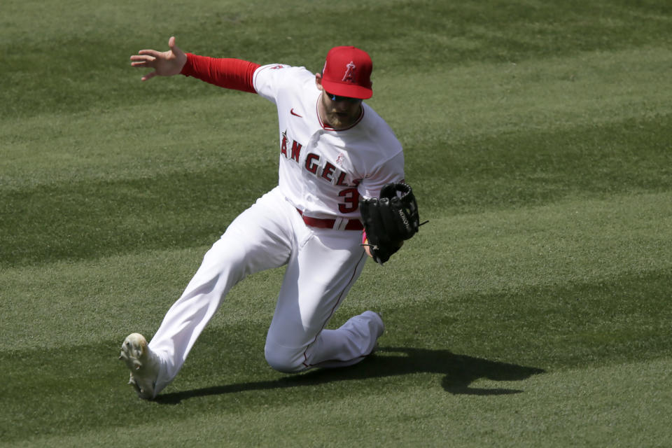 Los Angeles Angels right fielder Taylor Ward makes a sliding catch on a fly ball hit by Los Angeles Dodgers' Will Smith during the fifth inning of a baseball game in Anaheim, Calif., Sunday, May 9, 2021. (AP Photo/Alex Gallardo)