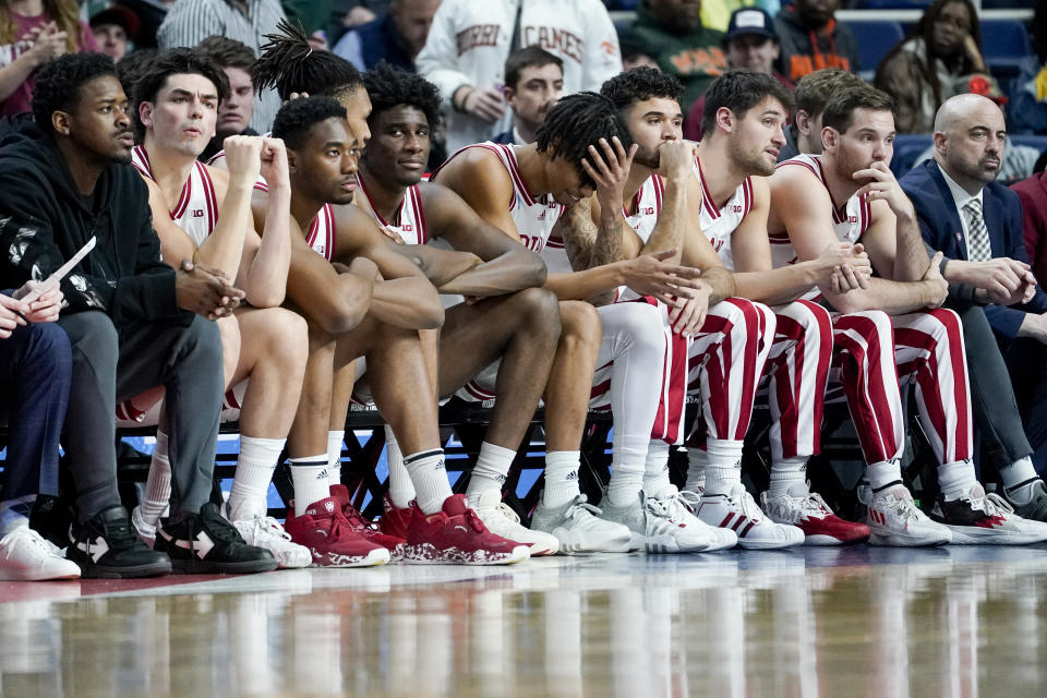 The Indiana bench reacts in the final moments of the second half of a second-round college basketball game against Miami in the NCAA Tournament, Sunday, March 19, 2023, in Albany, N.Y. (AP Photo/John Minchillo)