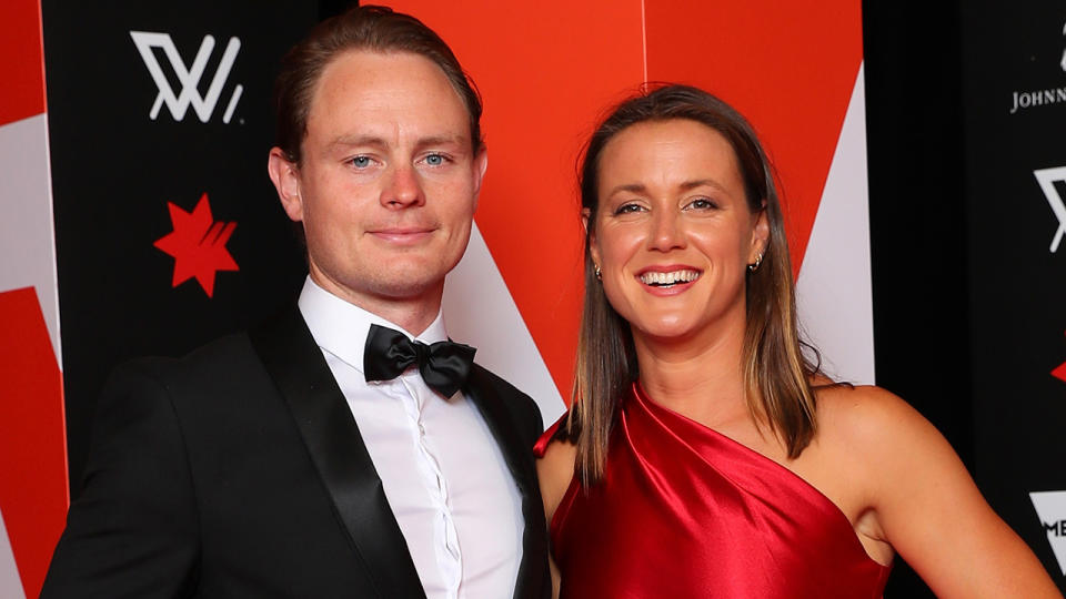 Nicola Barr attends the AFLW Awards accompanied by Lloyd Perris.