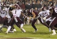 Oct 27, 2018; Starkville, MS, USA; Mississippi State Bulldogs quarterback Nick Fitzgerald (7) scores a touchdown against the Texas A&M Aggies during the second half at Davis Wade Stadium. Mandatory Credit: Vasha Hunt-USA TODAY Sports