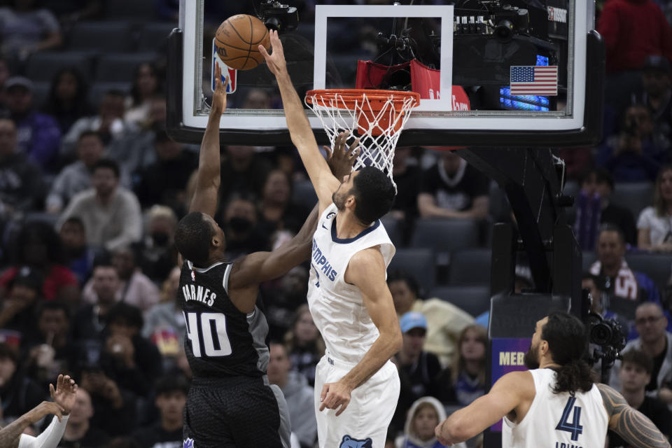 Memphis Grizzlies forward Santi Aldama (7) blocks the shot of Sacramento Kings forward Harrison Barnes (40) in the second half of an NBA basketball game in Sacramento, Calif., Thursday, Oct. 27, 2022. The Grizzlies won 125-110. (AP Photo/José Luis Villegas)