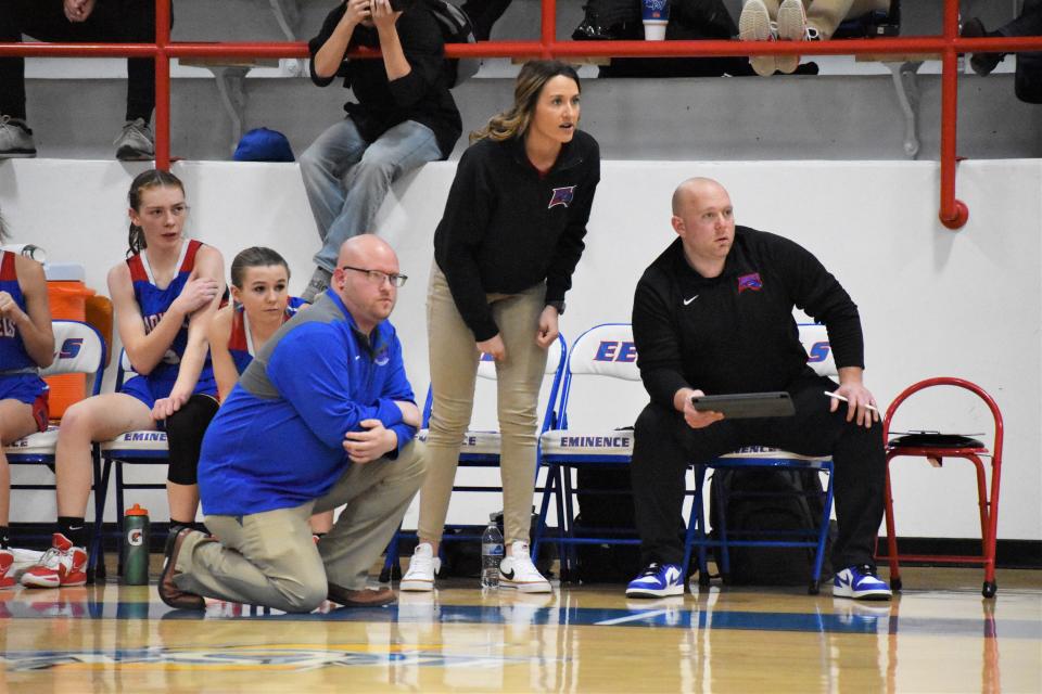 Eminence head coach Greg Burton (left) and his staff observe the Eels' offense during the sectional championship matchup with Greenwood Christian on Feb. 4, 2023.