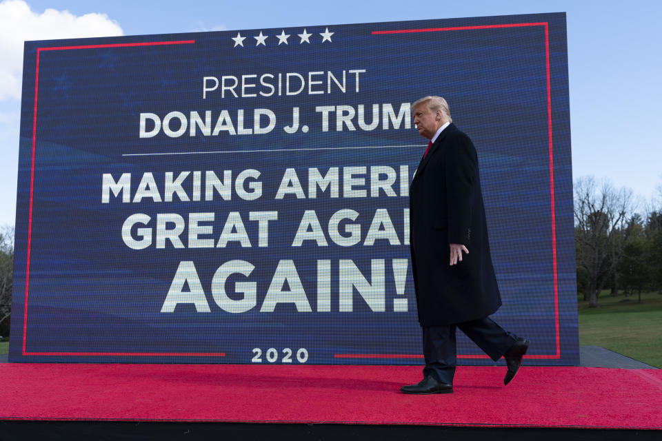 President Donald Trump walks to the podium to speak at a campaign rally at Keith House, Washington's Headquarters, Saturday, Oct. 31, 2020, in Newtown, Pa. (AP Photo/Alex Brandon)