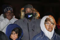 Rodney Wells, stepfather of Tyre Nichols, listens to speakers at a prayer gathering at the site where Nichols was beaten by Memphis police officers, and later died from his injuries, in Memphis, Tenn., Monday, Jan. 30, 2023. (AP Photo/Gerald Herbert)